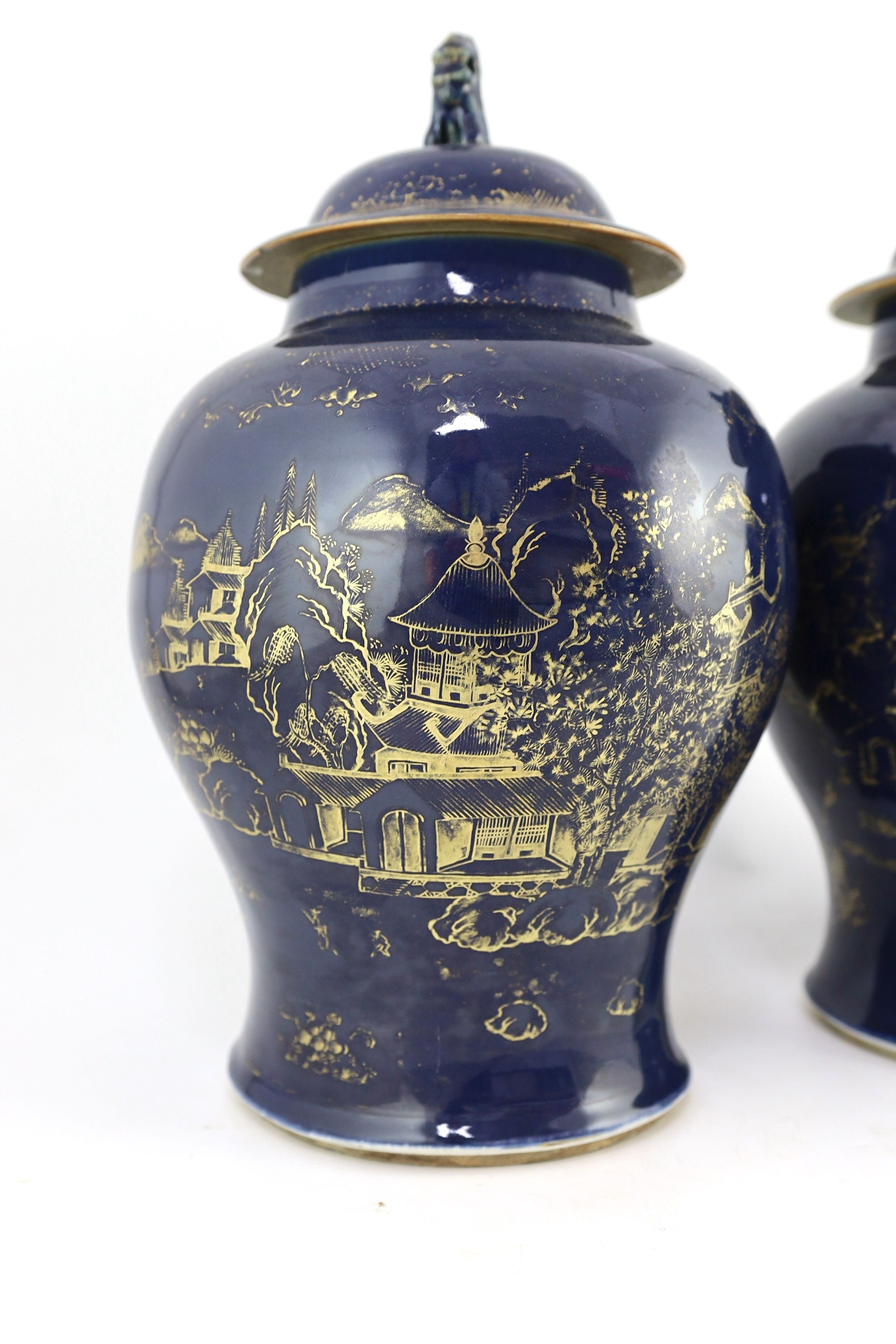 A pair of Chinese gilt-decorated blue ground baluster vases and covers, 19th century, 44 cm high